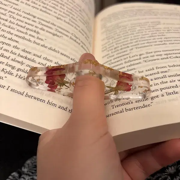 reading book with a acrylic book page holder